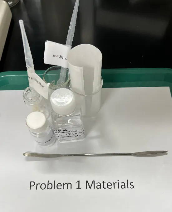 2023 USNCO Part III Problem 1 materials: standardized NaOH, methyl orange indicator, unknown monoprotic acid, spatula