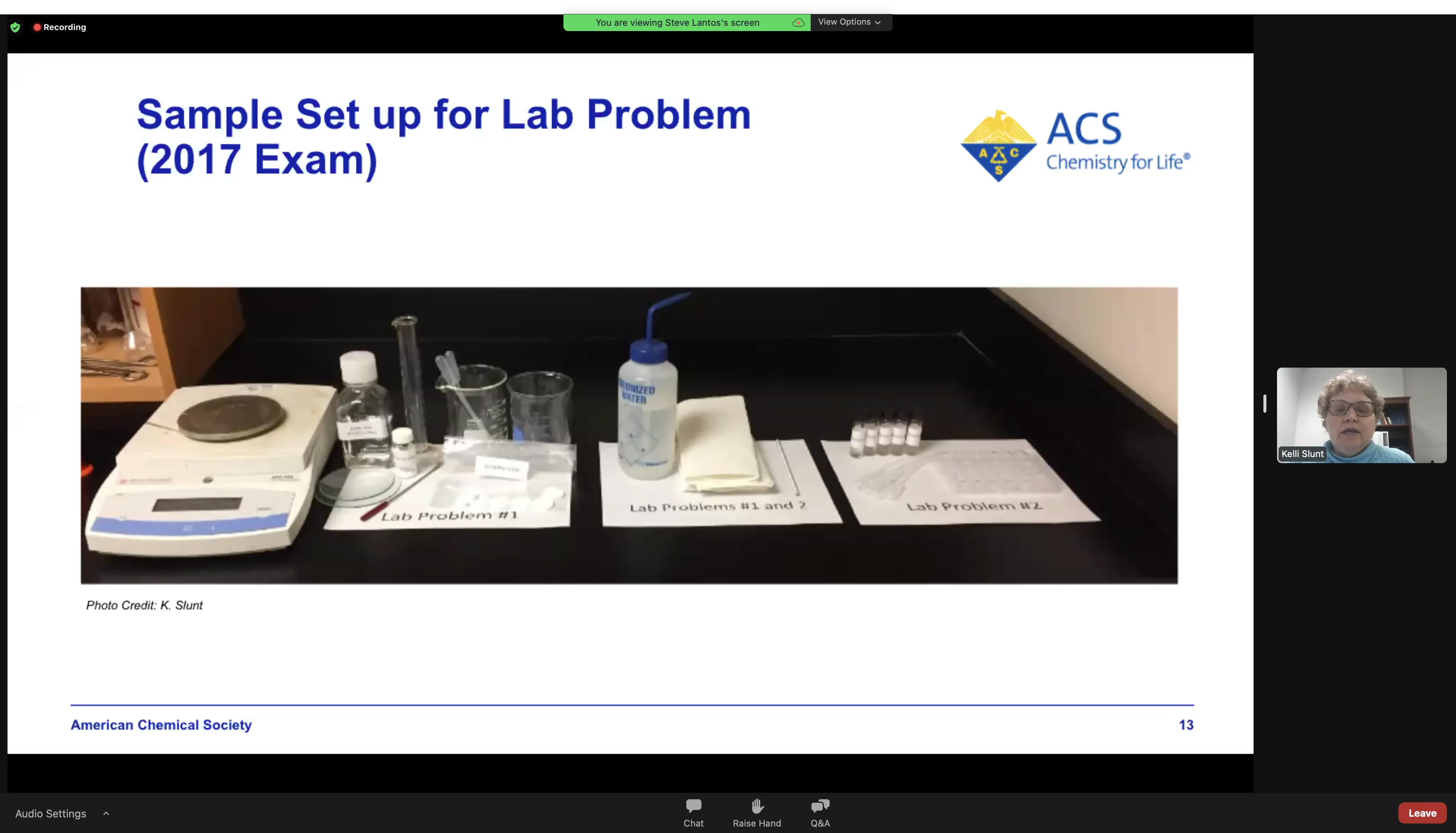 Sample lab bench setup from 2017 USNCO Part III exam showing three zones: Problem 1 on left, shared items in center, Problem 2 on right